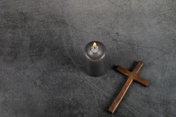 Catholic Cross with burning candle. Ash Wednesday, Lent season, Holy Week, Good Friday and Palm Sunday concept. Copy space. - obrazy, fototapety, plakaty