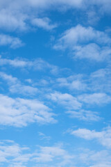 blue sky and white stratocumulus clouds.