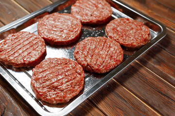 The waiter served the plate of fried sausages to customers of the cafe.