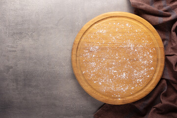 Cutting board and scattered flour powder on stone background top table