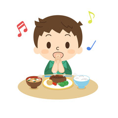 笑顔でいただきますをする男の子