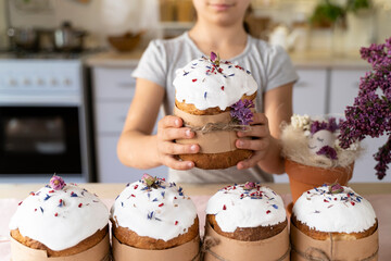 cute child girl holds an Easter cake in his hands. Happy Easter. Homemade cakes for holidays, healthy food, healthy sweets for children