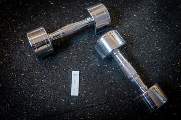 negative Covid rapid test lies next to a medical mask and dumbbells in a gym