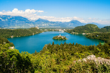 Fototapeta na wymiar View of Lake Bled in Slovenia. In the background the high rocky corners of the Julian Alps.