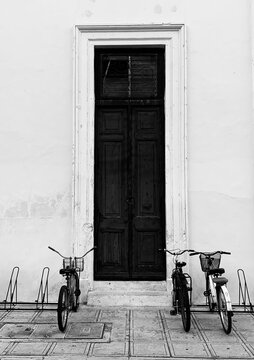 old bicycle in front of a house