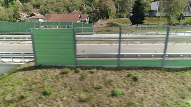 Transparent highway noise barriers environment fence parallel flight drone shot