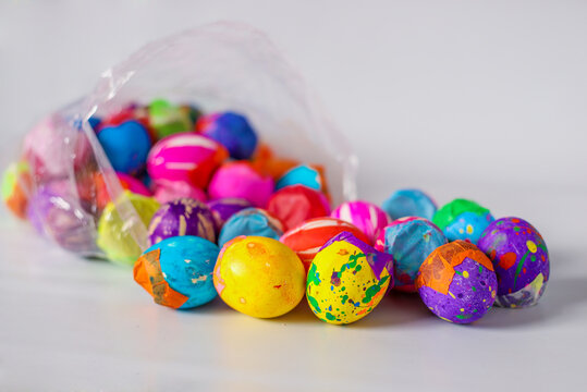 Painted eggshells in a colorful way and filled with confetti for carnaval, a latinamerican tradition specially in Guatemala. Placed on a white background. 