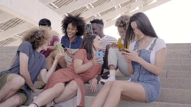 Group of people using mobile phone. Friends happy connection technology.