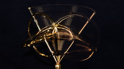 Golden Gyroscope Spinning on its Base