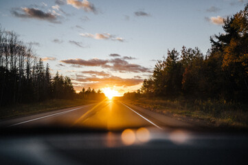 glowing sunset on the highway beautiful bokeh fall colors