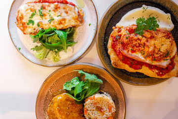 milanese parmesan with mashed potato, grilled chicken and parmesan eggplant, gourmet menu