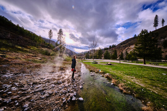 A young woman following the water at Kirkham hot springs.