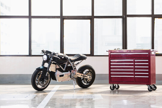 electric motorcycle parked at workshop in Bangkok