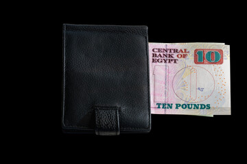 Wallet with 10 Egyptian pound bank note isolated on black background. - obrazy, fototapety, plakaty