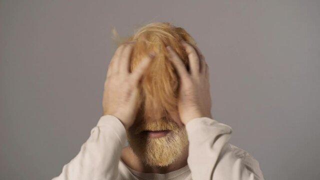 Comic funny blonde berded man. Human emotions, hipster with funny face. Guy movement hair.