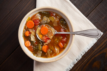 Overhead view of healthy cabbage vegetable soup with copy space