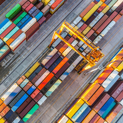 Aerial view of shipping container port terminal. Colourful pattern of containers in harbor....