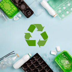 Separate collection of plastic garbage. PET stuff for recycle on blue background. Eco friendly...