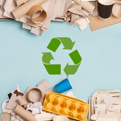 Separate collection of paper garbage. Stuff for recycle on blue background. Eco friendly concept. Isolated recyclable paper waste: cardboard,egg carton,disposable cup, paper sleeve. Zero waste banner