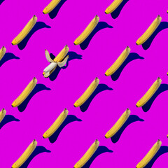 Pattern. Yellow bananas on a pink background 