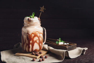 Mason jar of sweet cocoa drink on dark background - Powered by Adobe
