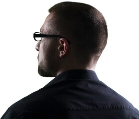 Obraz premium Silhouette of a young thinking businessman.