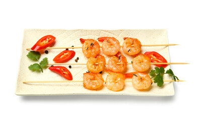 Plate with grilled shrimp skewers on white background