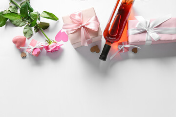 Gifts for Valentine Day, bottle of wine and rose on light background