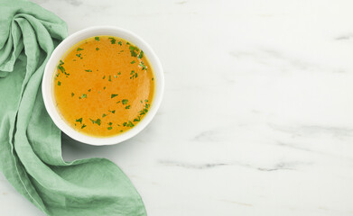 bowl of fresh chicken broth