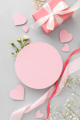 Composition with blank card, flowers and gift for Valentine's Day on white background