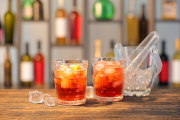 Glasses of tasty Negroni cocktail on table in bar