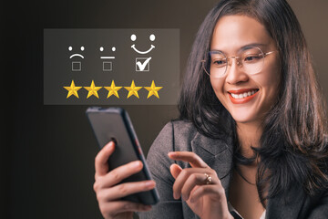 Smiley woman holding smartphone giving feedback consumer or review evaluation, satisfaction level. Business satisfaction support. Humans rate and giving stars. - obrazy, fototapety, plakaty