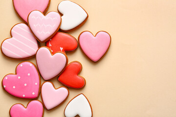 Tasty heart shaped cookies on beige background