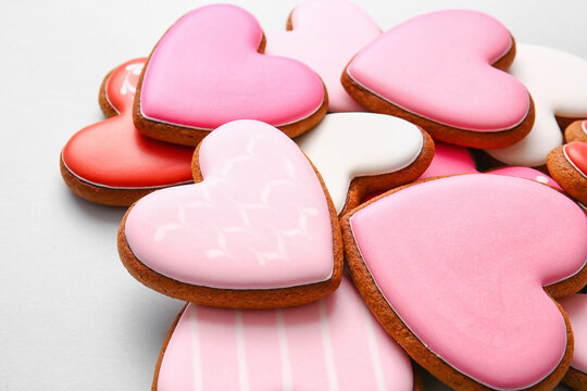 Tasty heart shaped cookies on light background, closeup