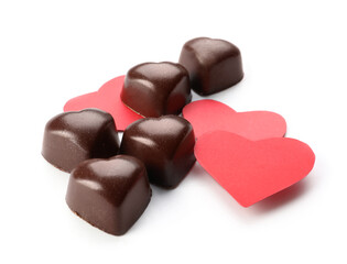 Tasty heart-shaped candies on white background