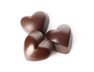 Tasty heart-shaped candies on white background
