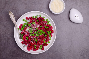 Beetroot pasta with green peas