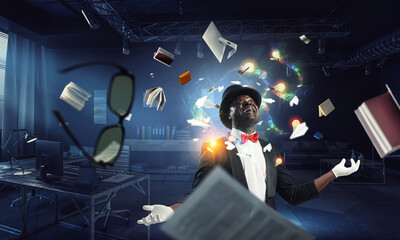 Male illusionist performing tricks . Mixed media