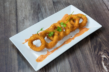 Crispy fried squid rolls.  Ingredients include fresh squid and ruffles and spices