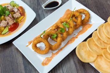 Crispy fried squid rolls.  Ingredients include fresh squid and ruffles and spices