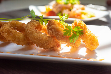 Crispy fried squid rolls.  Ingredients include fresh squid and ruffles and spices