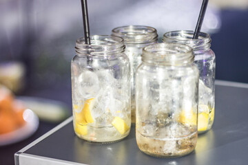 Pitcher with ice and lemon ready to prepare the drink