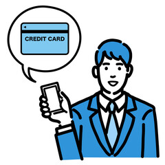 スマートフォンを持ってクレジットカードの説明をしているスーツを着た若い男性
