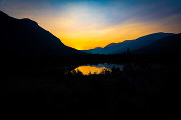 sunset over the lake in the mountains