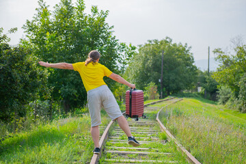 reckless passenger runs along the sleepers behind the train