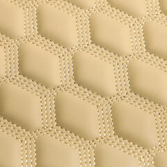 Texture of beige leather background with square pattern and stitch, macro