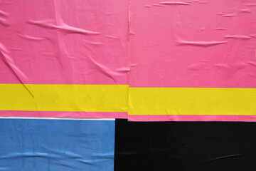 Colourful wrinkled creased peeling street poster layers 