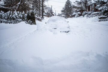 Toronto, Ontario / Canada - January 17, 2022 - Toronto St Clair West car covered with snow on day of snowstorm