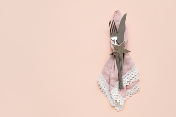 Stylish cutlery on pink background