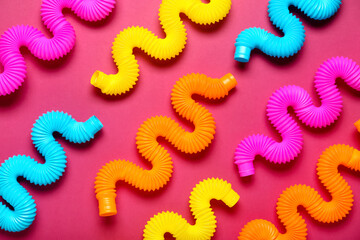 Different Pop Tubes on color background